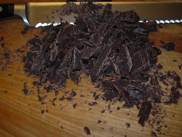 Chop chocolate using a serrated knife